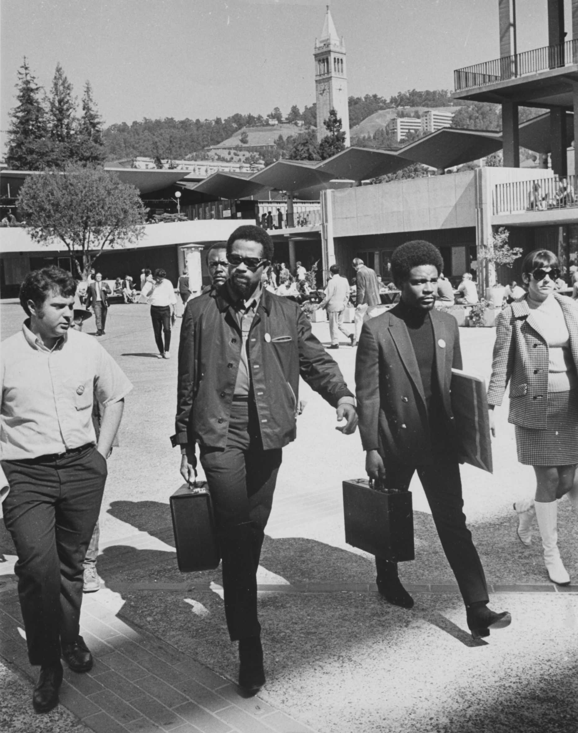 Black and white photo of Lawrence Magid, Eldridge Cleaver, and Emory Douglas, Black Panther Party artist in 1968 at UC Berkeley.